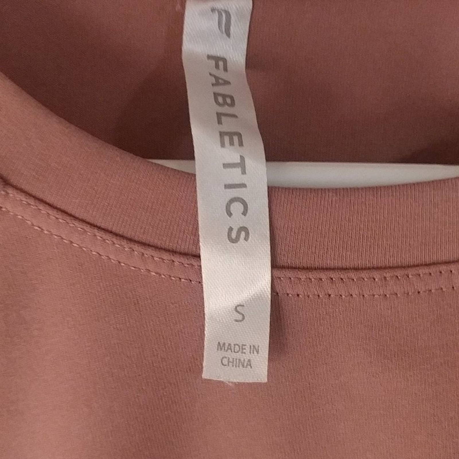 Fabletics shirt with a rouched sleeve