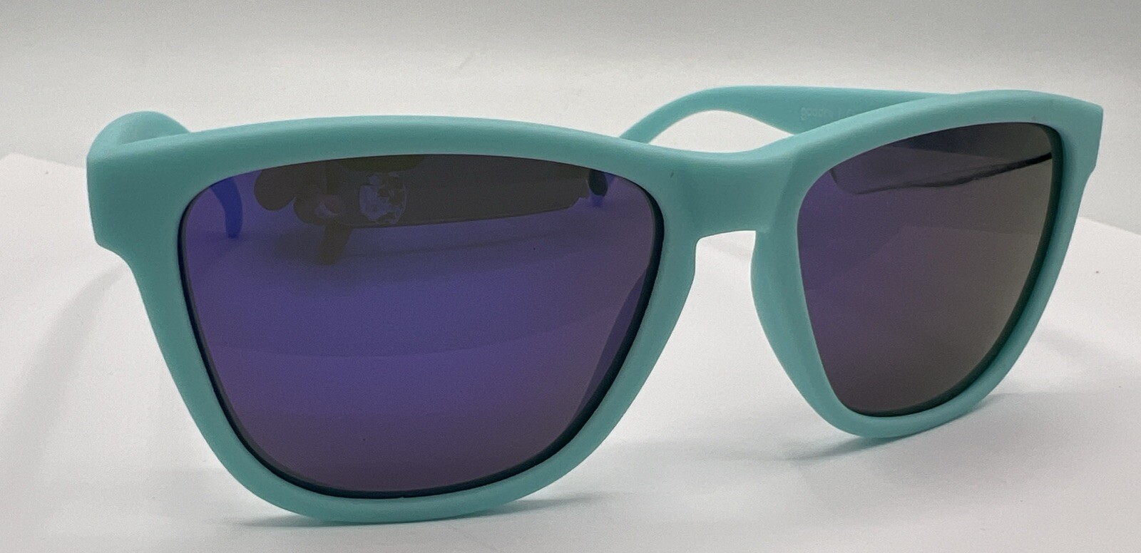 Goodr Sunglasses “Electric Dinotopia Carnival” Active Teal PurpLens OG Polarized