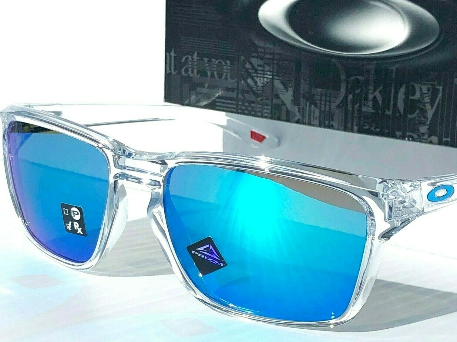 Oakley SYLAS Clear Crystal polished w PRIZM Sapphire Blue Sunglass 9448-04 57